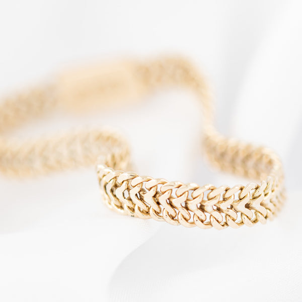 Pulsera eslabón tejido en oro amarillo 14 kilates.