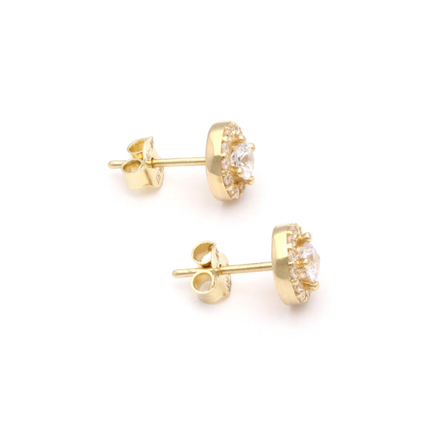 Aretes diseño especial con circonias en oro amarillo 14 kilates.