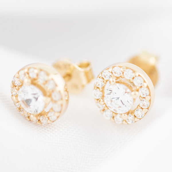 Aretes diseño especial con circonias en oro amarillo 14 kilates.
