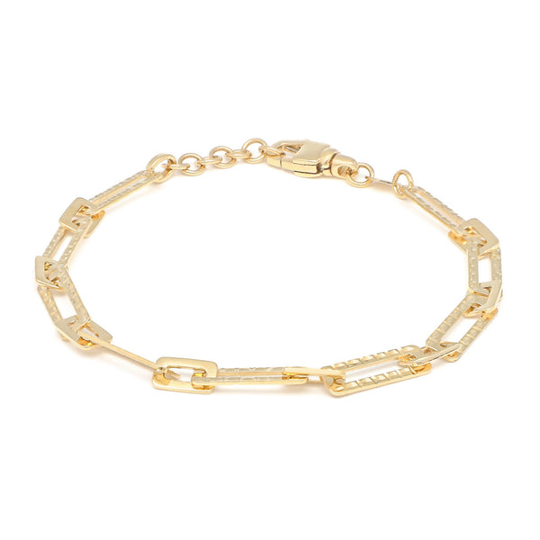 Pulsera eslabón cruzado en oro amarillo 14 kilates.
