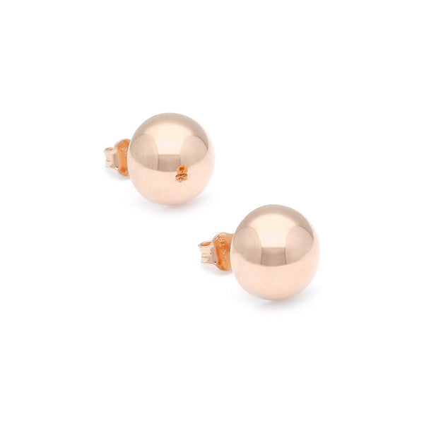 Aretes huecos motivo media esfera en oro rosa 14 kilates.