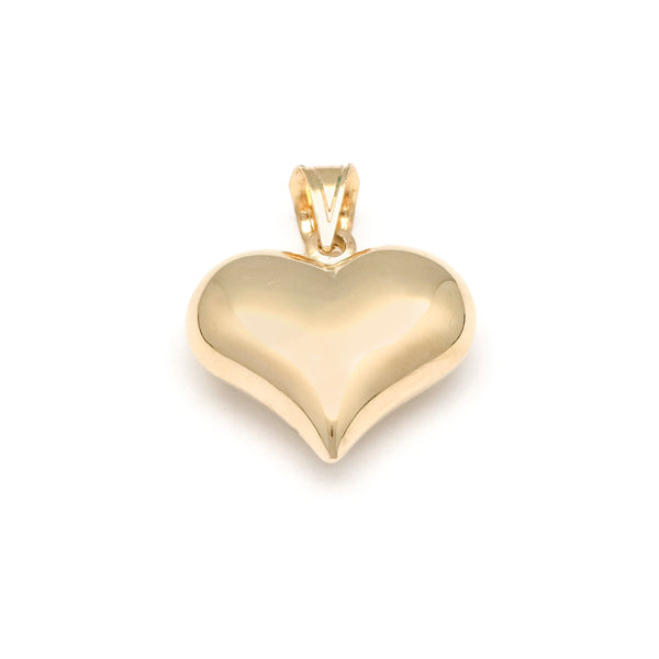 Dije hueco motivo corazón en oro amarillo 14 kilates.