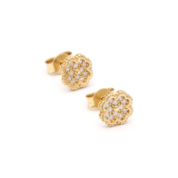 Aretes diseño especial con circonias motivo flor en oro amarillo 14 kilates.