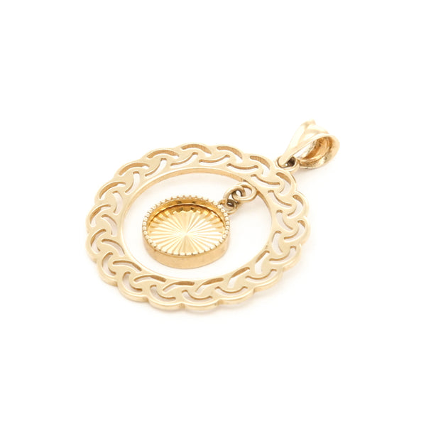 Dije calado con colgante motivo circulo en oro amarillo 14 kilates.