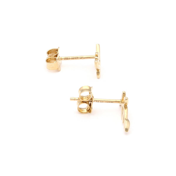 Aretes facetados motivo hojas en oro amarillo 14 kilates.