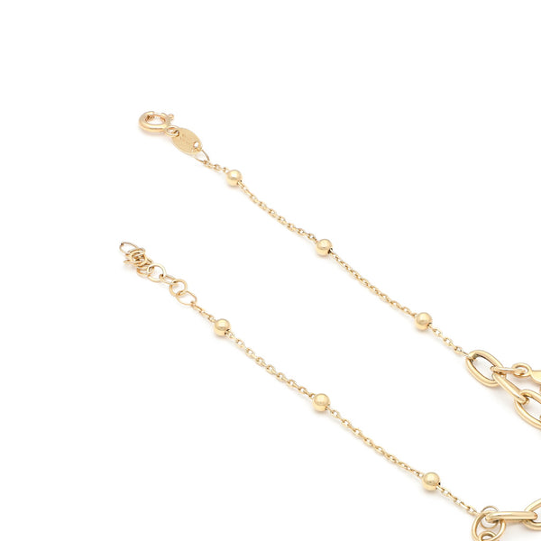Pulsera eslabón cruzado con aplicaciones y colgantes motivo flores en oro amarillo 14 kilates.