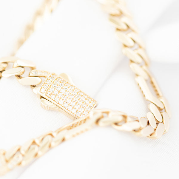 Pulsera de seis eslabones por uno con circonias en oro amarillo 14 kilates.