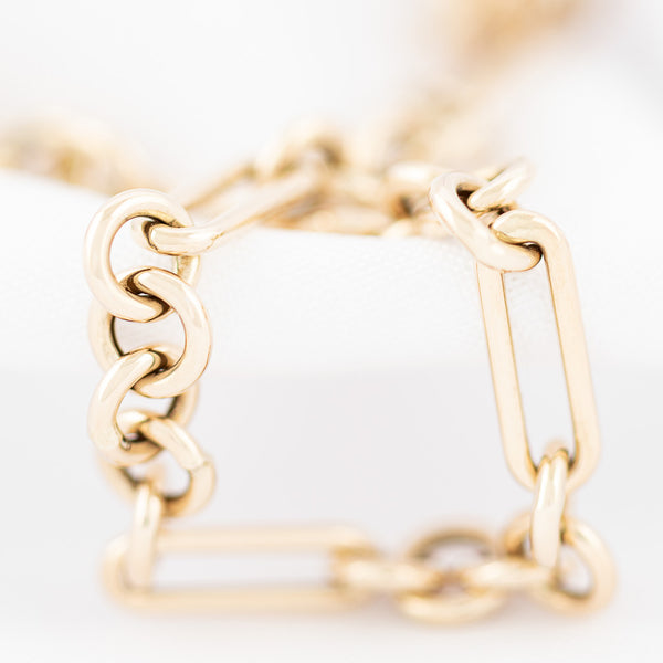 Pulsera eslabón combinado en oro amarillo 14 kilates.