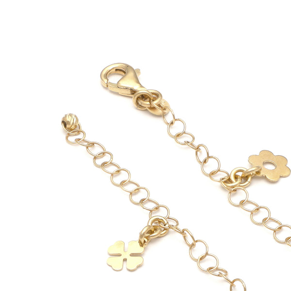 Pulsera eslabón cruzado con colgantes motivo figuras diferentes en oro amarillo 14 kilates.