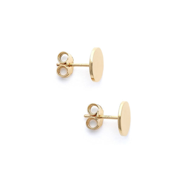 Aretes lisos motivo circulo en oro amarillo 14 kilates.