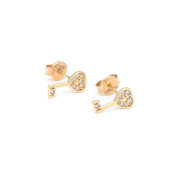Aretes diseño especial motivo llave con circonias en oro amarillo 14 kilates.