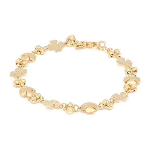 Pulsera eslabón combinado motivo tréboles en oro amarillo 14 kilates.