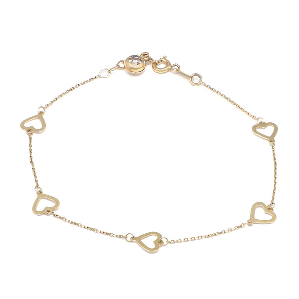 Pulsera eslabón cruzado con aplicaciones motivo corazón y sintético en oro amarillo 14 kilates.