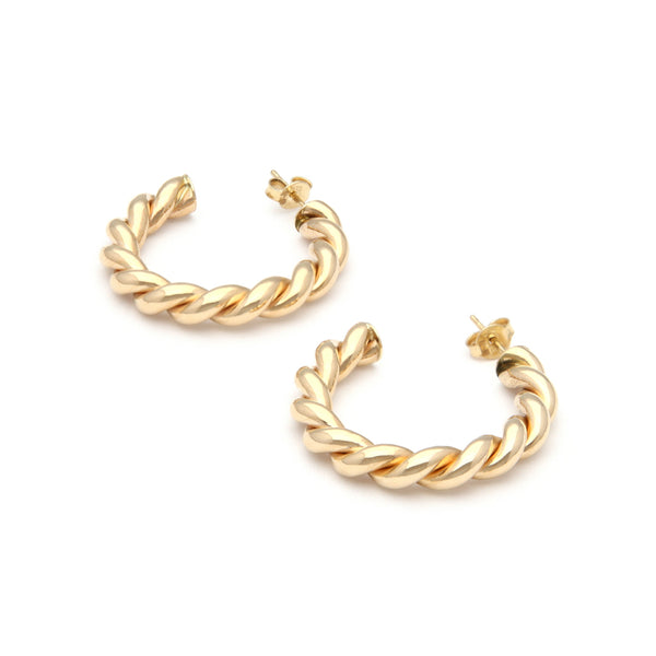 Aretes torzales en oro amarillo 14 kilates.