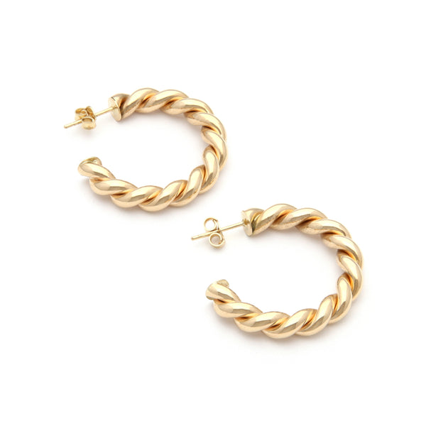 Aretes torzales en oro amarillo 14 kilates.