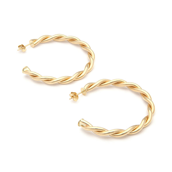 Aretes torzales en oro amarillo 14 kilates.