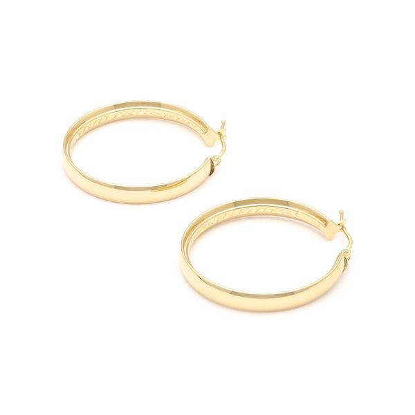 Arracadas lisas en oro amarillo 14 kilates.