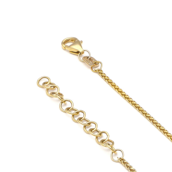 Pulsera eslabón tejido con aplicaciones en oro amarillo 14 kilates.