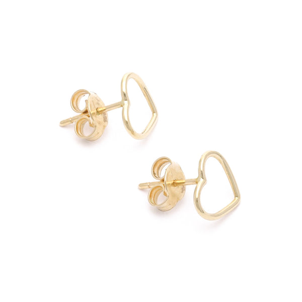 Aretes lisos motivo corazón en oro amarillo 14 kilates.
