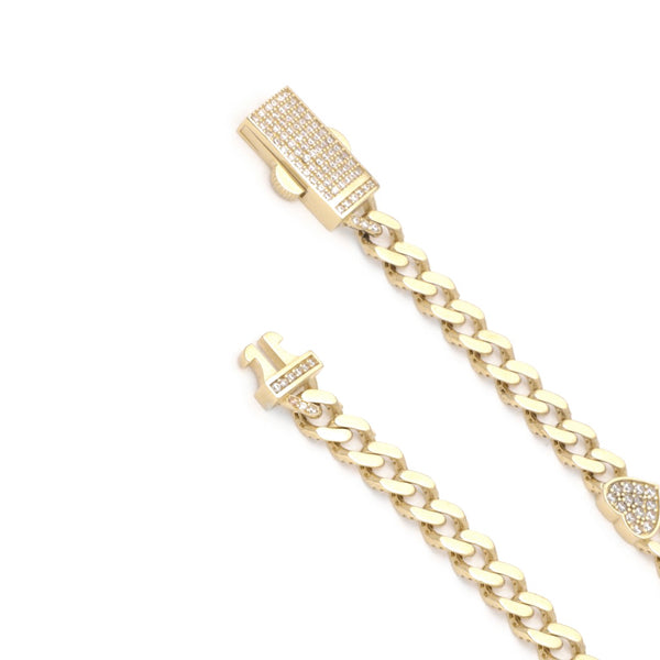 Pulsera eslabón encontrado con aplicaciones motivo corazón y circonias en oro amarillo 14 kilates.