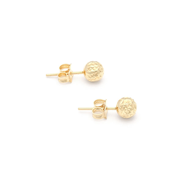 Aretes facetados en oro amarillo 14 kilates.