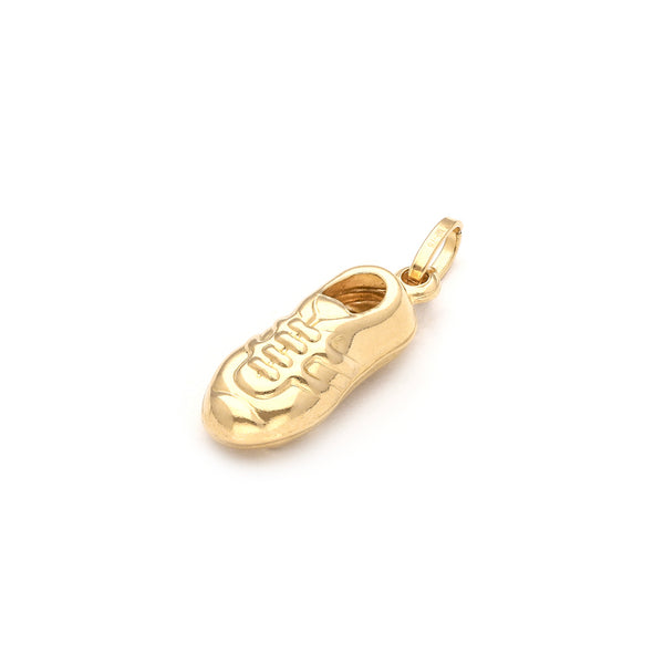 Dije hueco motivo zapato de futbol en oro amarillo 14 kilates.