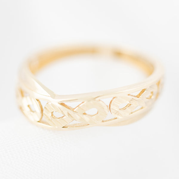 Anillo calado motivo infinito en oro amarillo 14 kilates.