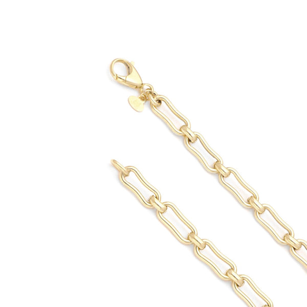 Pulsera eslabón cruzado en oro amarillo 14 kilates.