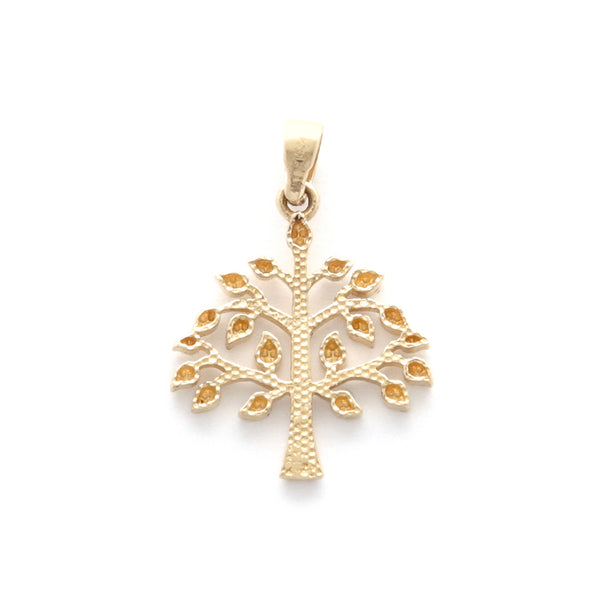 Dije facetado motivo árbol en oro amarillo 14 kilates.