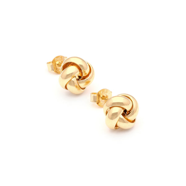 Aretes diseño especial motivo nudo en oro amarillo 14 kilates.