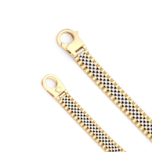 Pulsera eslabón articulado en oro dos tonos 14 kilates.