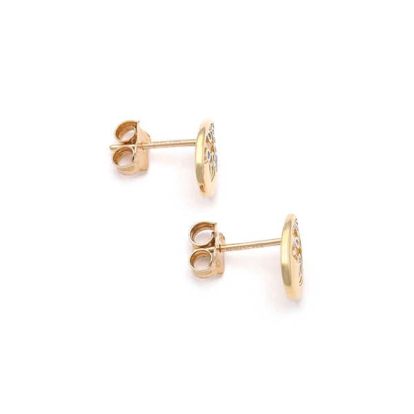 Aretes calados motivo gota en oro amarillo 14 kilates.