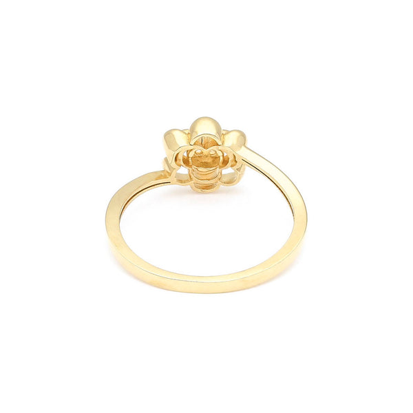 Anillo calado motivo flor con circonia en oro amarillo 14 kilates.
