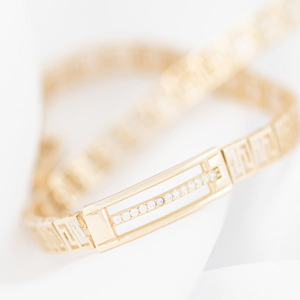 Pulsera eslabón articulado con circonias en oro amarillo 14 kilates.