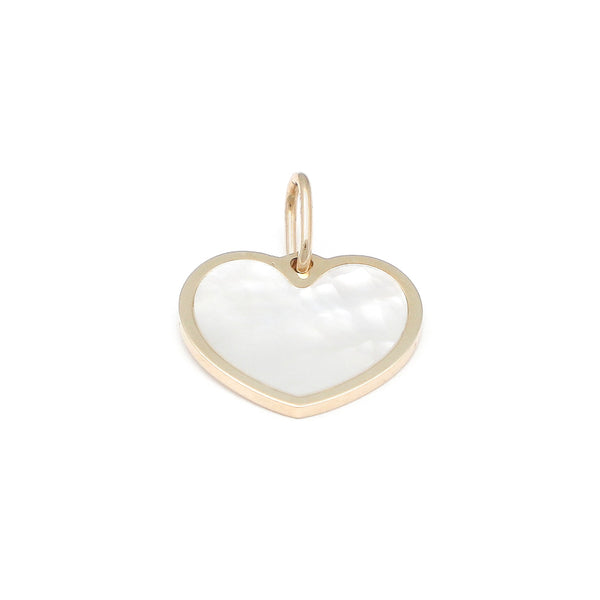 Dije liso motivo corazón con madre perla en oro amarillo 14 kilates.