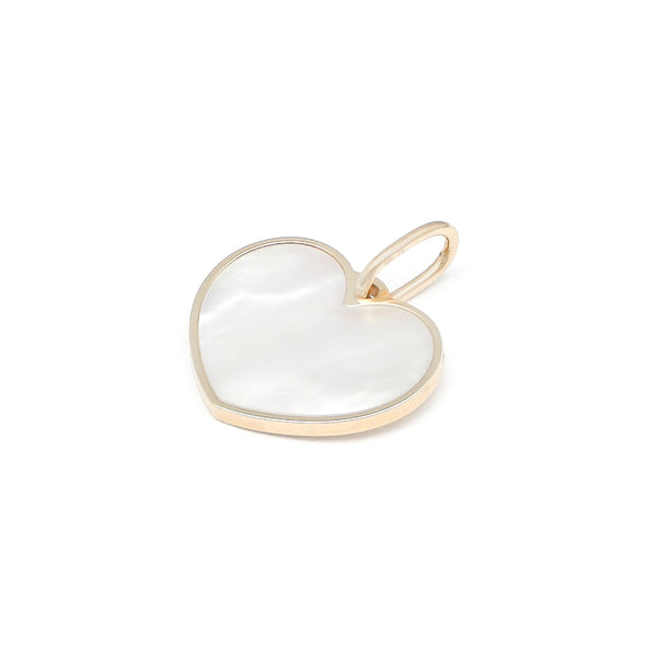 Dije liso motivo corazón con madre perla en oro amarillo 14 kilates.