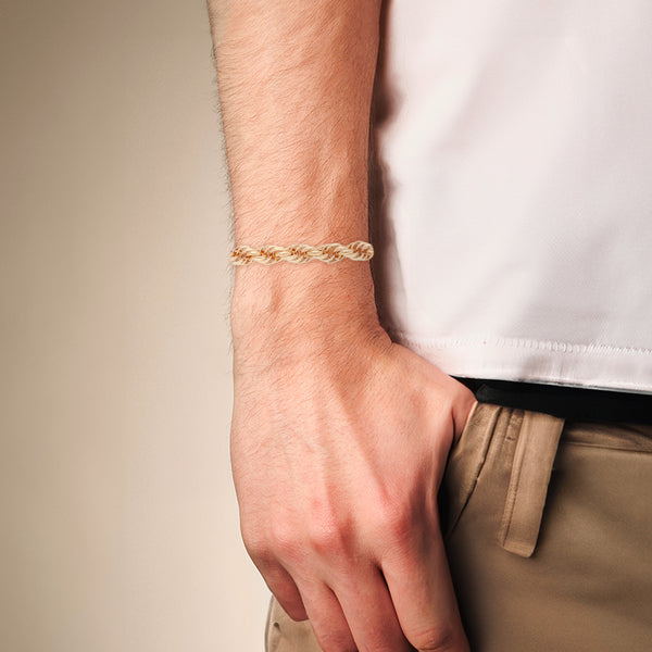 Pulsera eslabón tejido en oro amarillo 14 kilates.