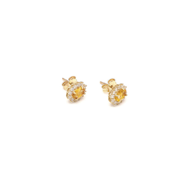 Aretes diseño especial con sintéticos en oro amarillo 14 kilates.