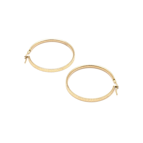 Arracadas facetadas en oro amarillo 14 kilates.
