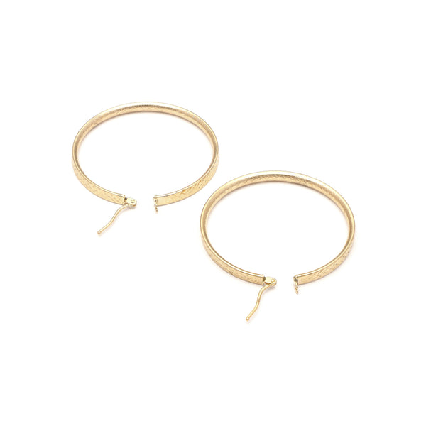 Arracadas facetadas en oro amarillo 14 kilates.