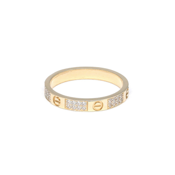 Argolla diseño especial motivo tornillos con circonias en oro amarillo 14 kilates.