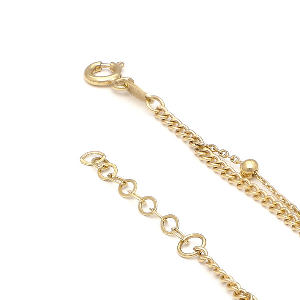 Pulsera de dos hilos eslabón combinado con aplicaciones y colgantes motivo corazón en oro amarillo 14 kilates.
