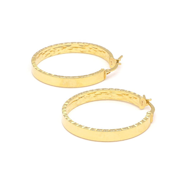 Arracadas lisas en oro amarillo 14 kilates.