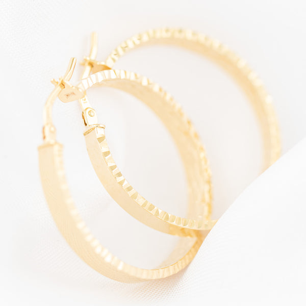 Arracadas lisas en oro amarillo 14 kilates.