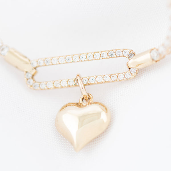 Pulsera eslabón articulado motivo corazón con circonias en oro amarillo 14 kilates.