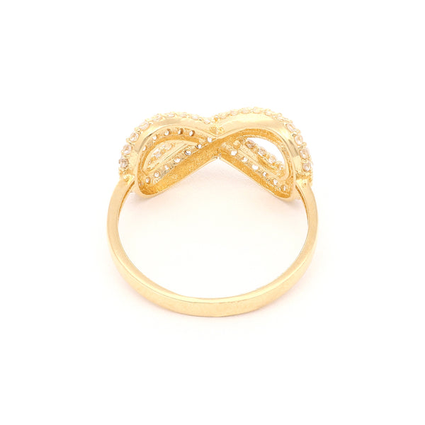 Anillo calado motivo infinito con circonias en oro amarillo 14 kilates.
