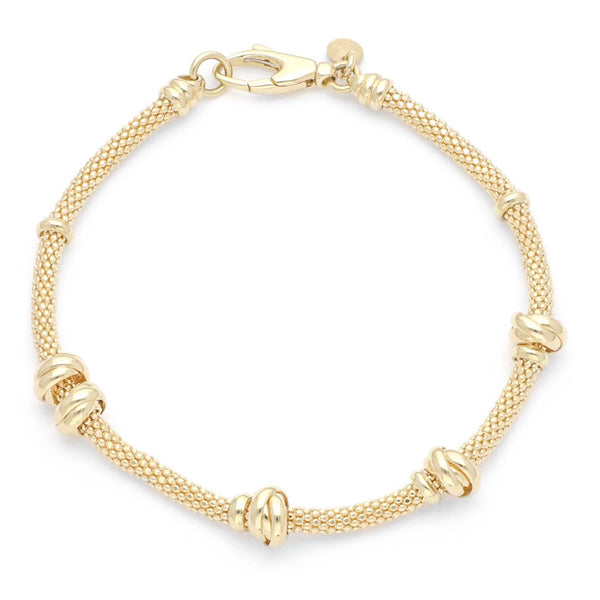 Pulsera eslabón tejido con aplicaciones en oro amarillo 14 kilates.