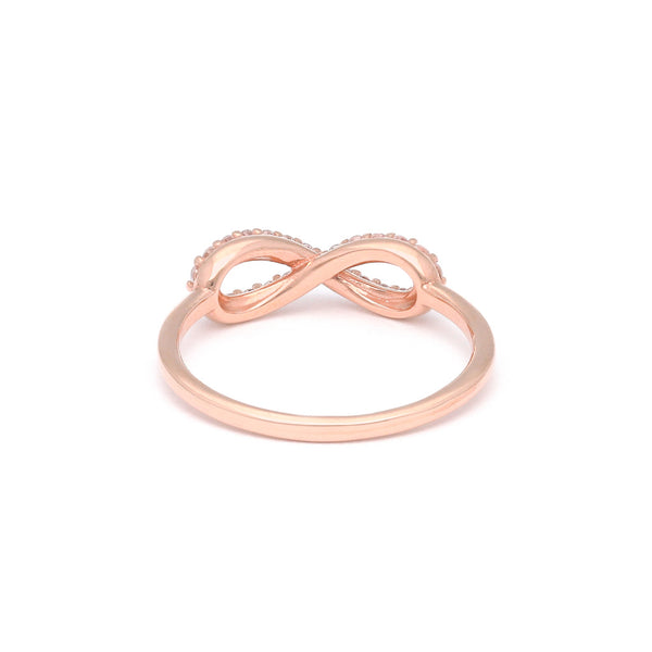 Anillo calado motivo infinito con circonias en oro rosa 14 kilates.