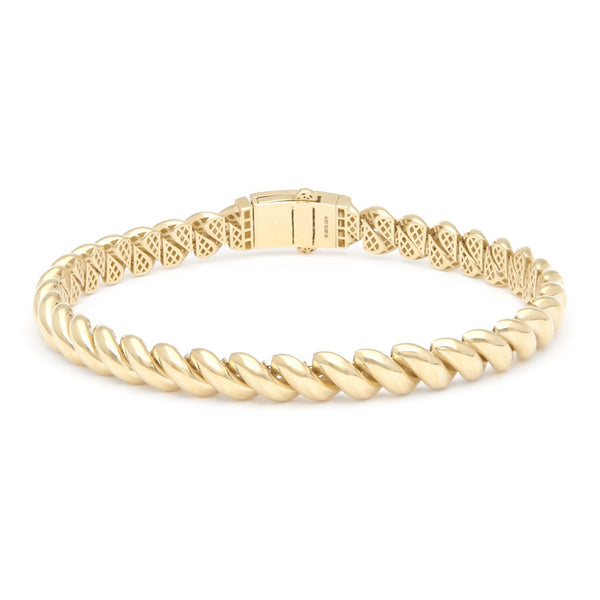 Pulsera eslabón articulado con circonias en oro amarillo 14 kilates.