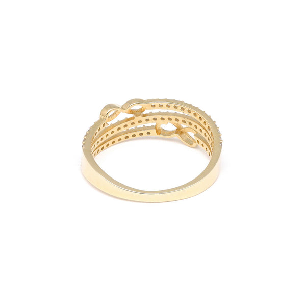 Anillo calado motivo infinitos con circonias en oro amarillo 14 kilates.